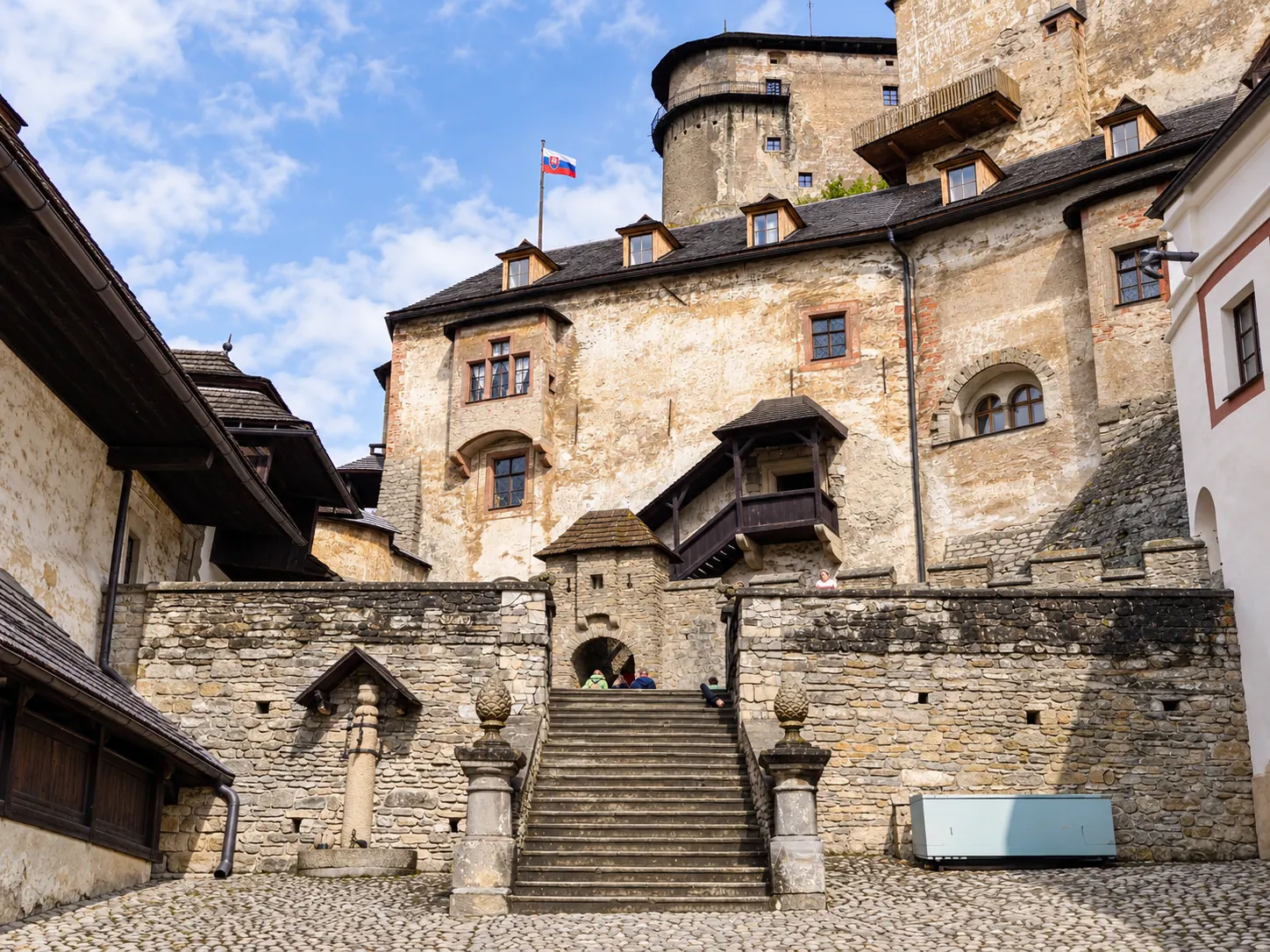 Stone stairs and historic buildings inside Orava Castle