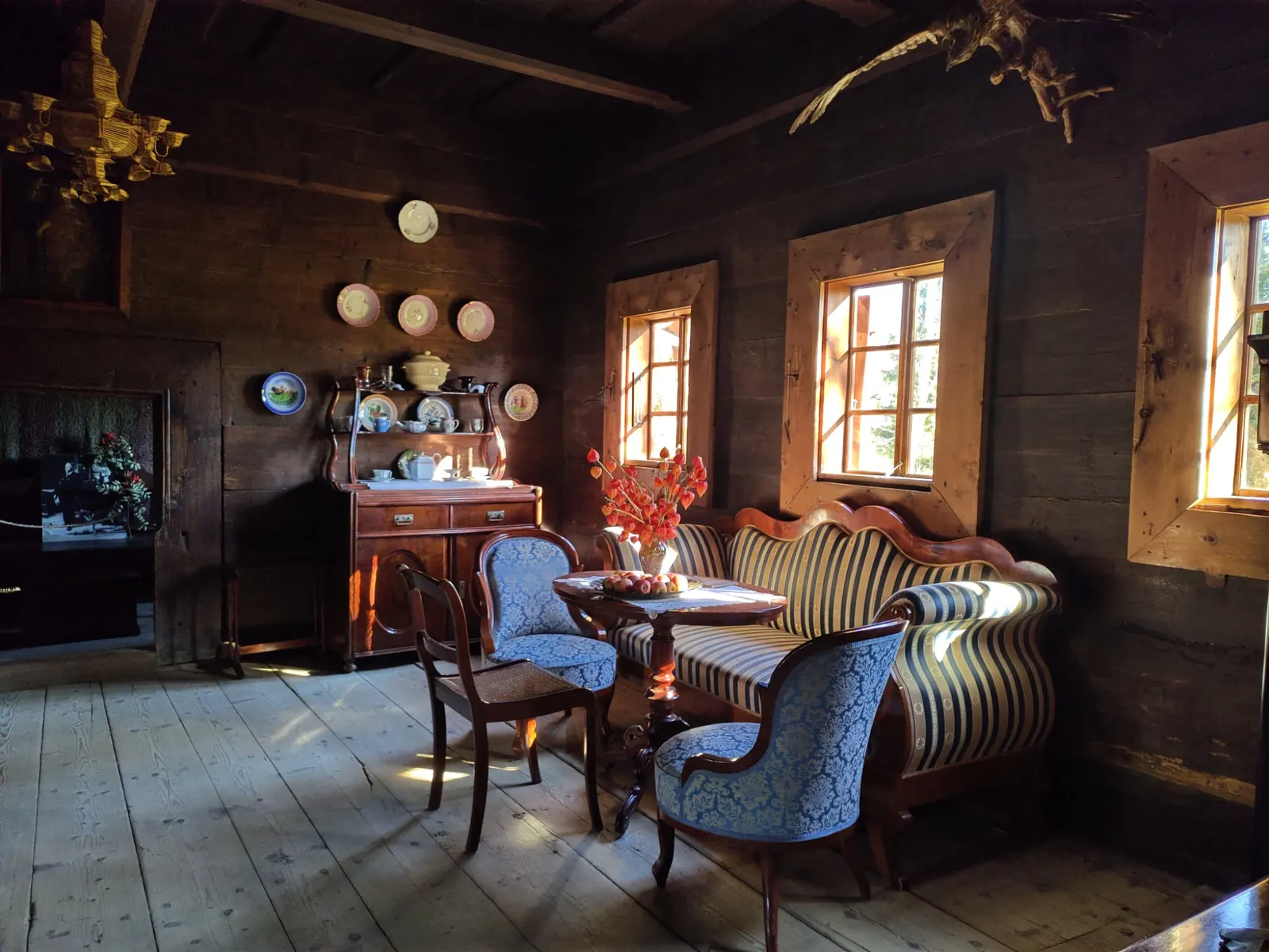 Traditional furnished wooden house interior at the Museum of Orava Village