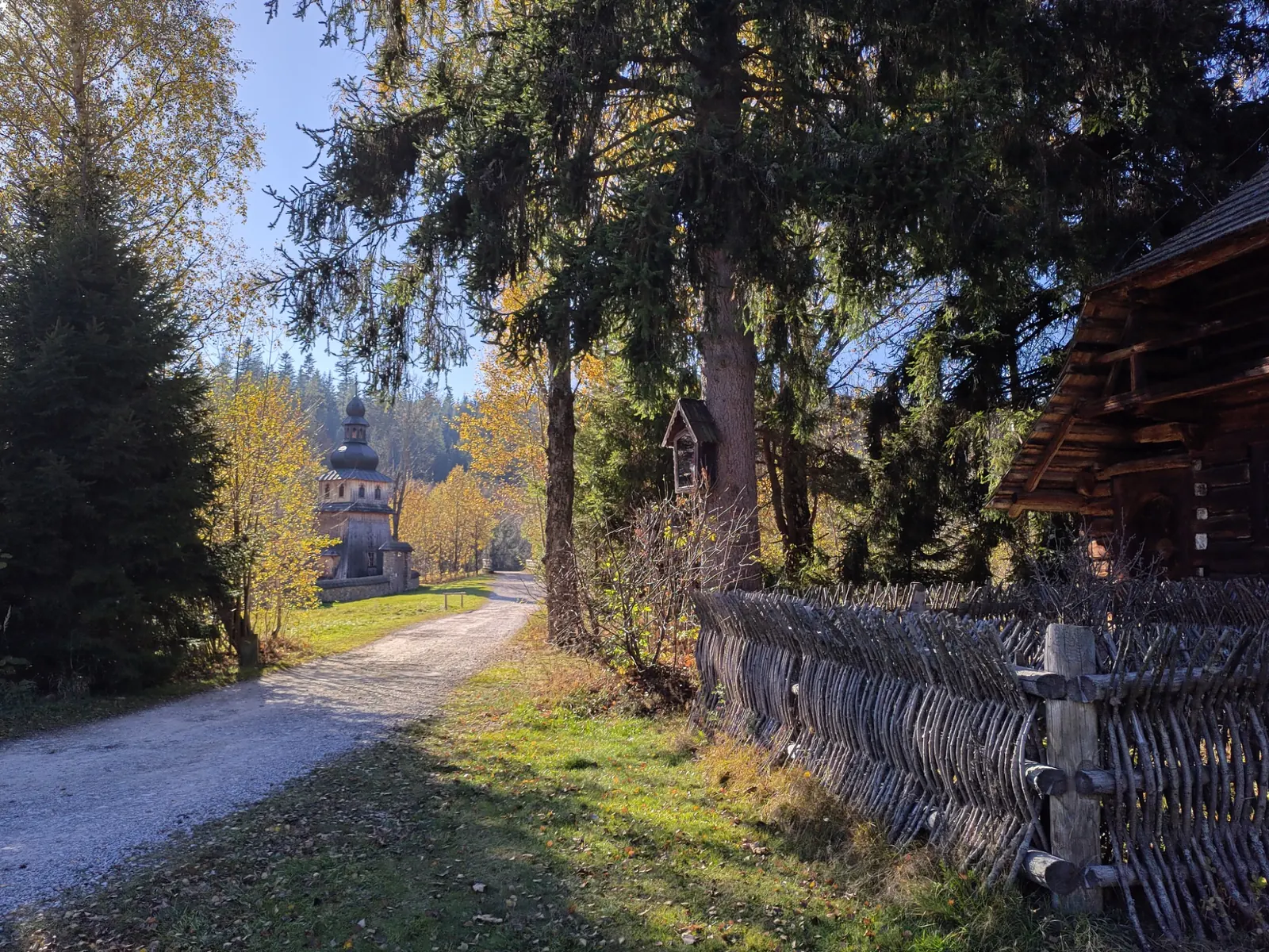 Wooden church and traditional buildings at the Museum of Orava Village in Zuberec
