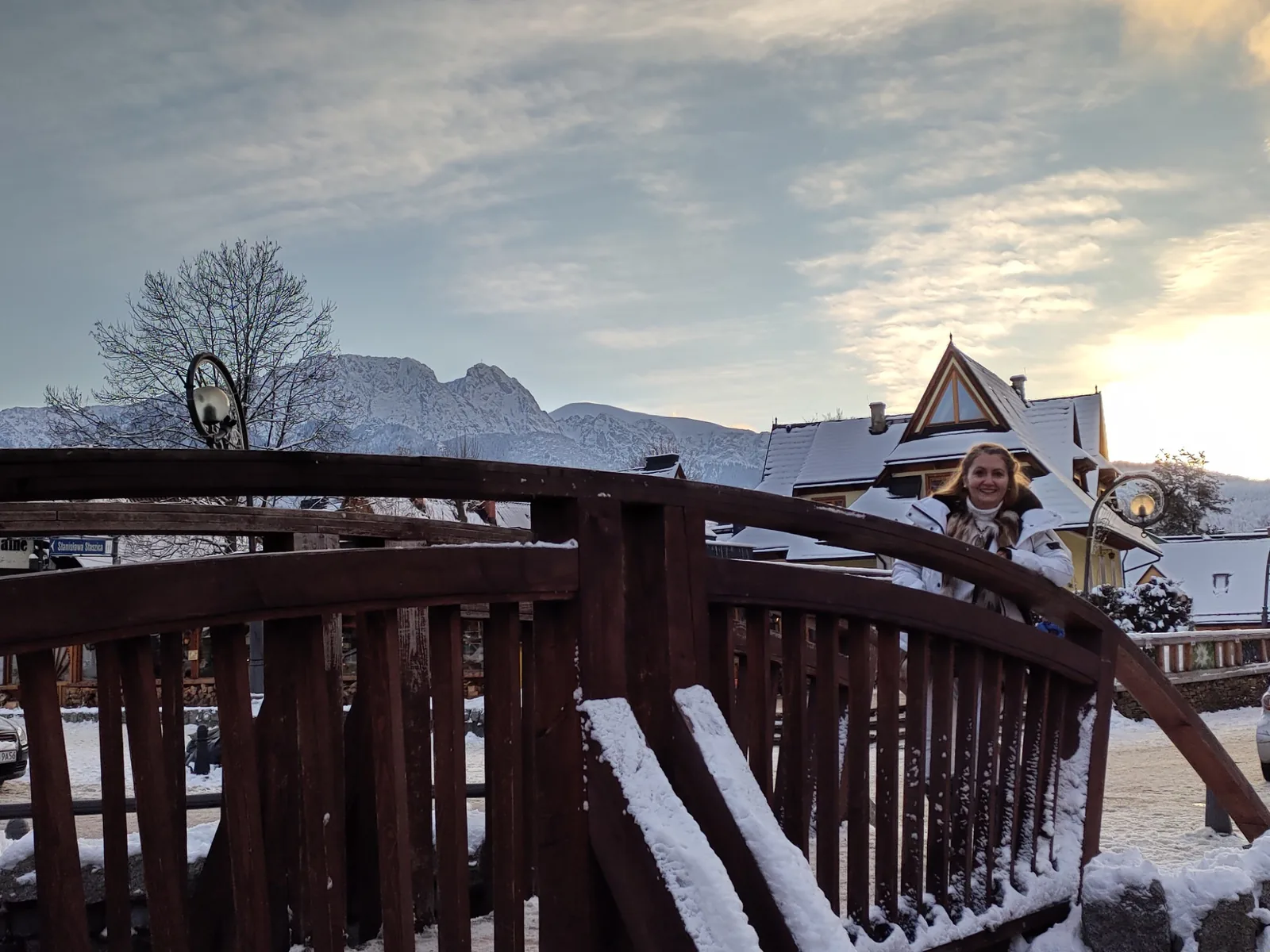 Wooden bridge in Zakopane with winter mountain scenery